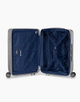 Open silver Bell Weather medium checked suitcase with navy lining, a zippered divider and tie-down straps.