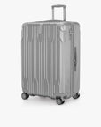 Angled front view of a silver Bell Weather large checked suitcase with its telescoping handle extended.