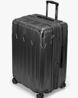 Angled view of a black Bell Weather large checked suitcase with its expansion section open.