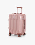 Angled front view of a rose gold Bell Weather carry-on with its telescoping handle extended.