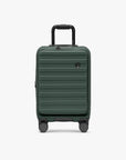 Green Novia carry-on viewed from the front with its telescoping handle extended.