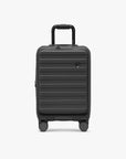 Black Novia carry-on viewed from the front with its telescoping handle extended.