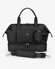 Black quilted Weekender Bag with Mini Tote attached and detachable shoulder strap arranged in front