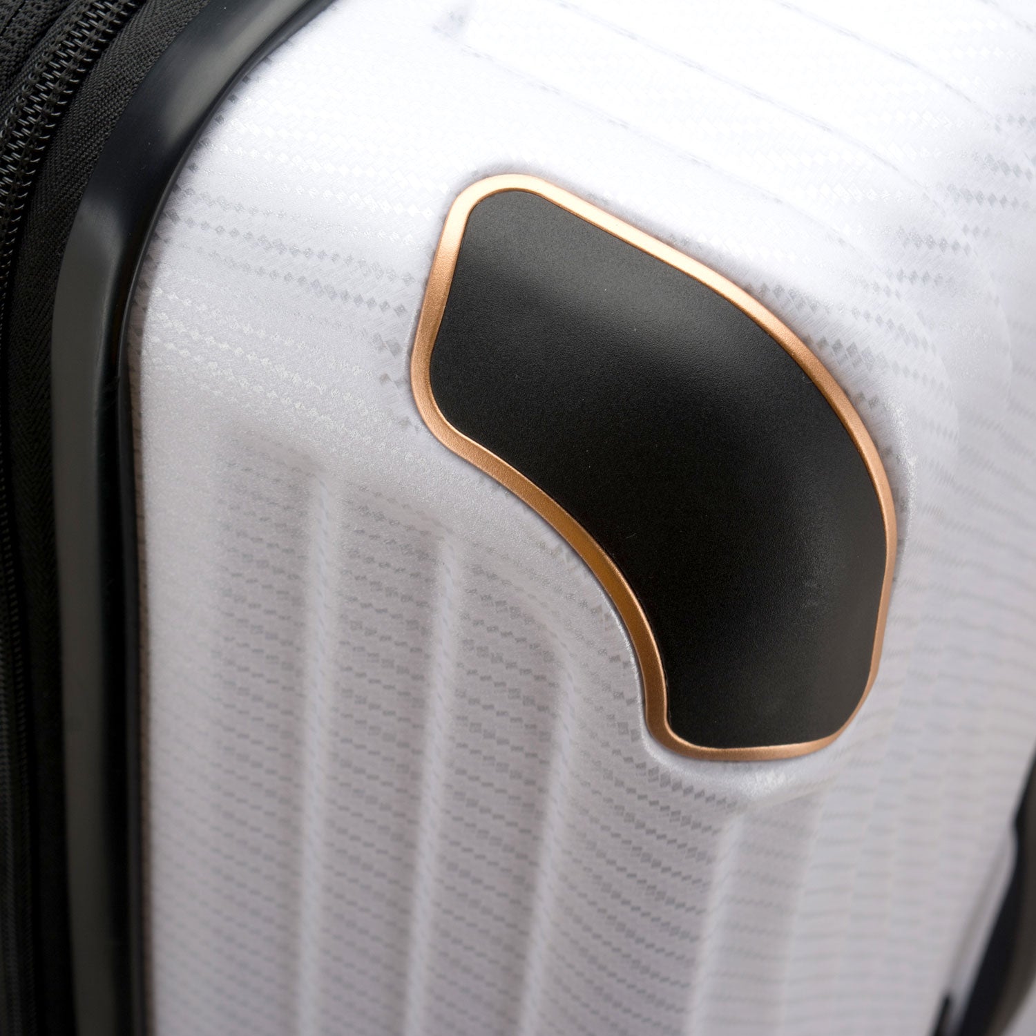 An image of the armor guards on the white trunk luggage. 