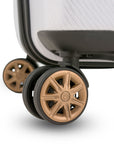 An image of a golden wheel on the white trunk luggage.