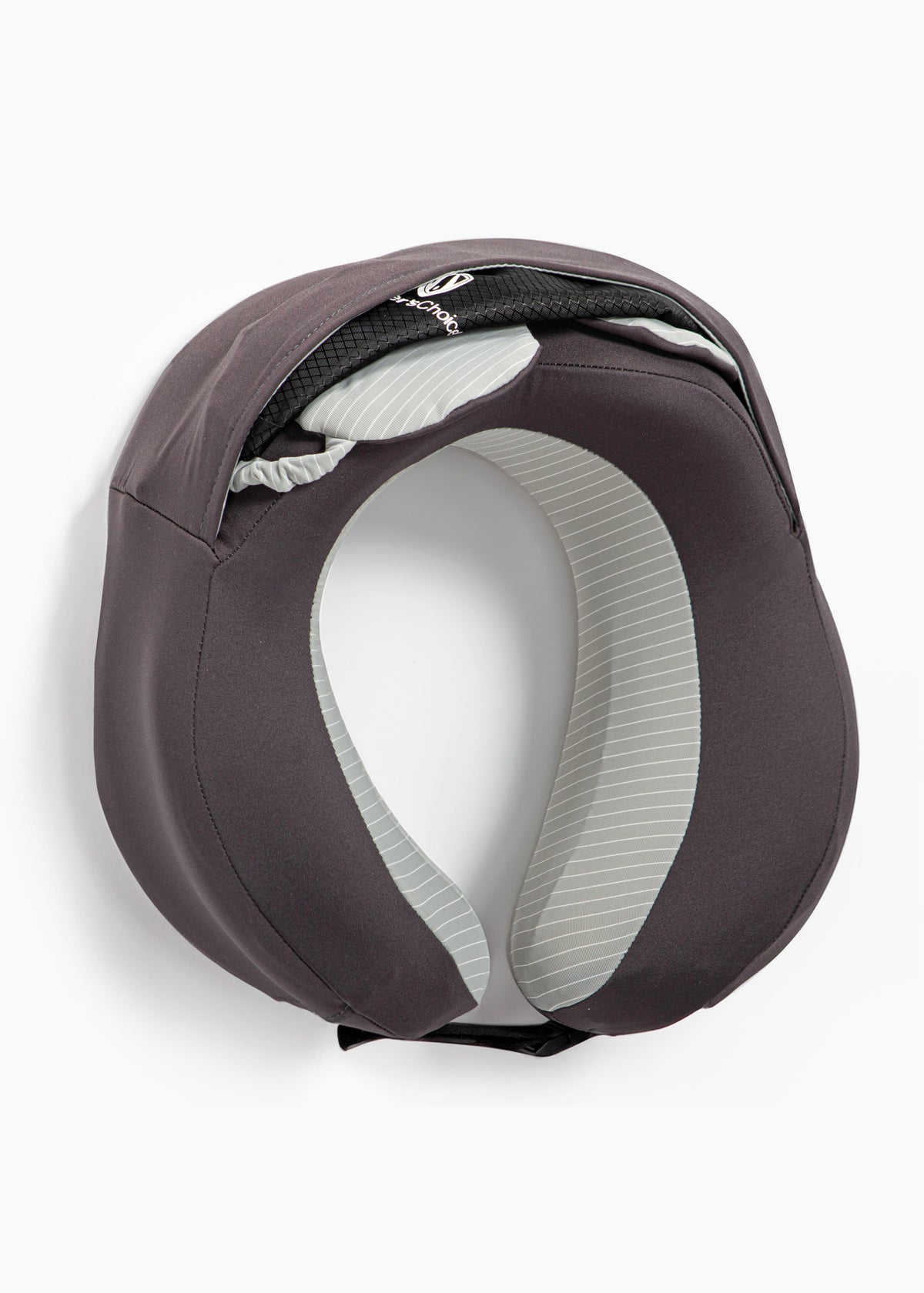 Eye mask and black travel bag tucked into the slip pocket on the back of the pillow