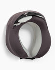 Eye mask and black travel bag tucked into the slip pocket on the back of the pillow