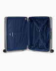 Open silver Bell Weather large checked suitcase with navy lining, a zippered divider and tie-down straps.