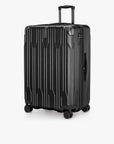 Angled front view of a black Bell Weather large checked suitcase with its telescoping handle extended.
