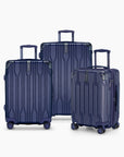Navy Bell Weather three-piece luggage set with carry-on, medium checked and large checked suitcases.