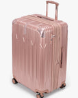 Angled view of a rose gold Bell Weather large checked suitcase with its expansion section open.