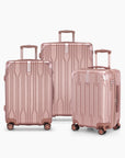 Three rose gold metallic hardshell spinner suitcases in graduated sizes