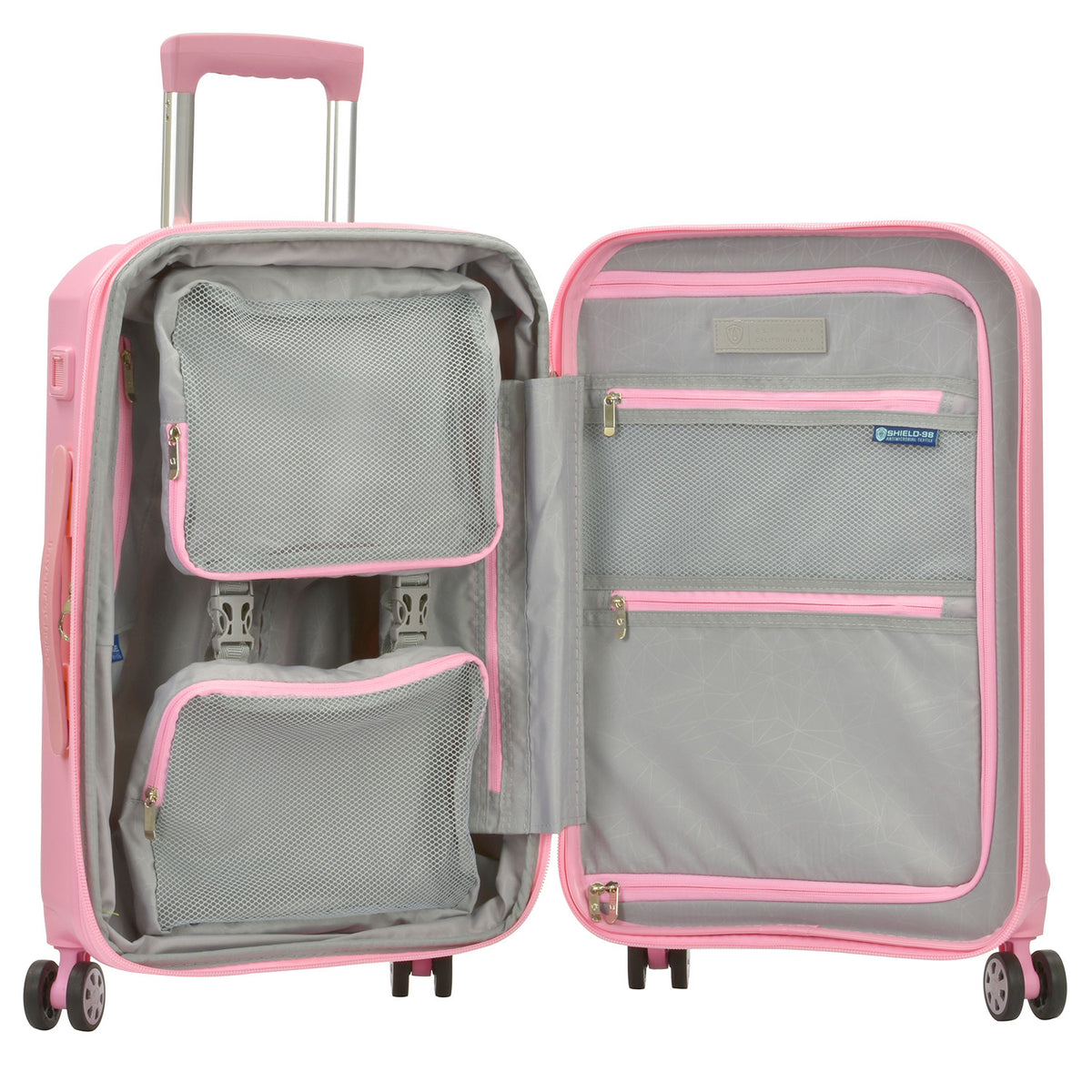 Open Pagosa carry-on interior showing two packed compartments with mesh zip cover and cross straps