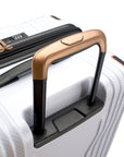 An image of the golden handle on a white trunk luggage.