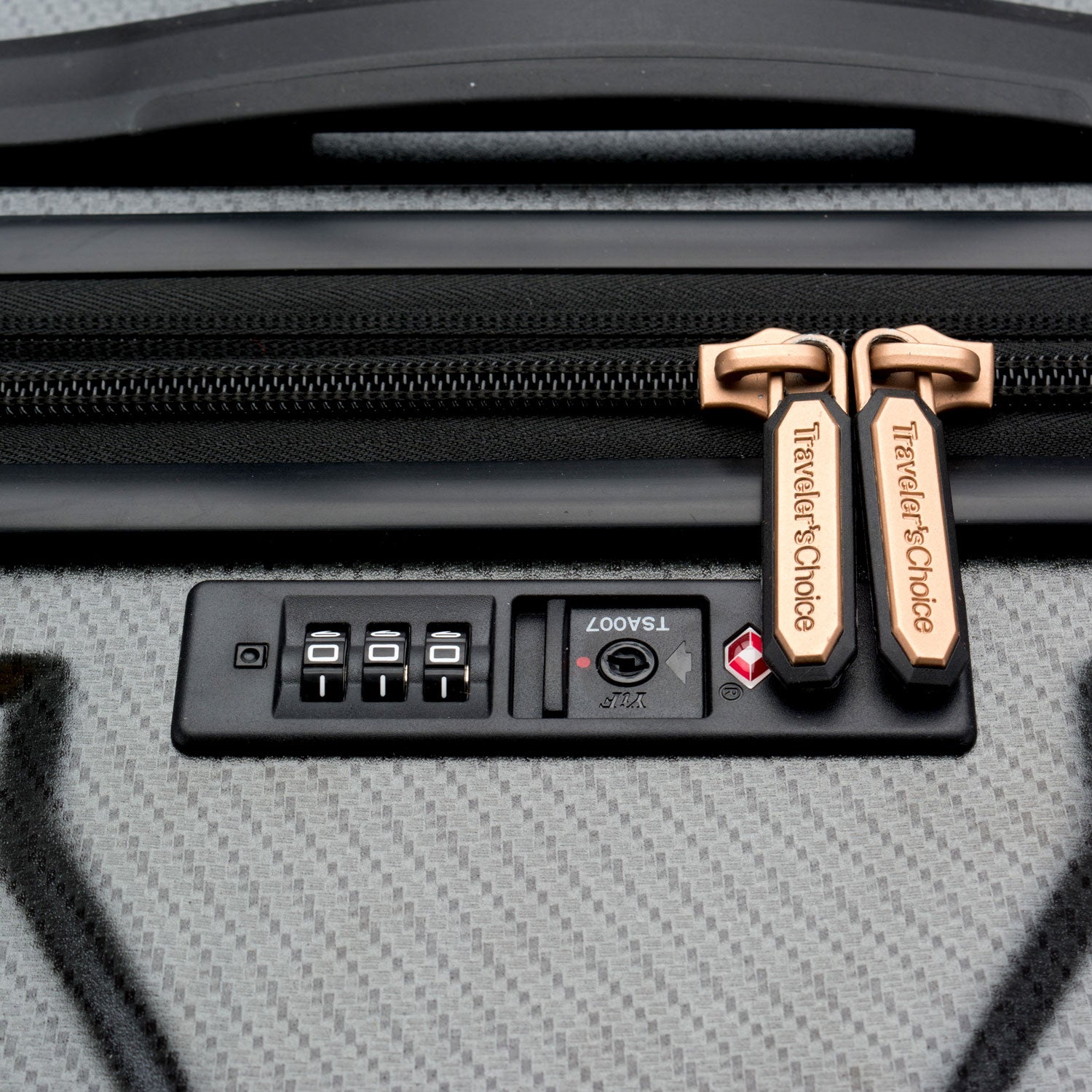 An image of the top of the gray luggage with the TSA lock.